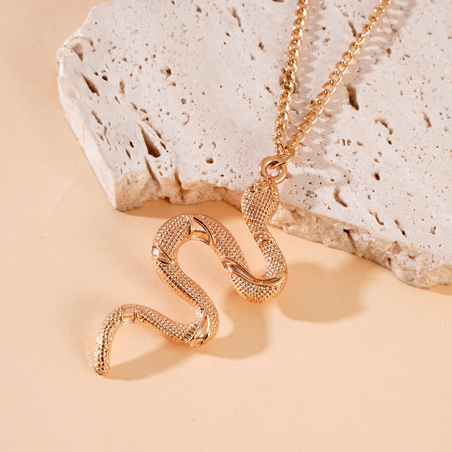 Rian's gold snake necklace